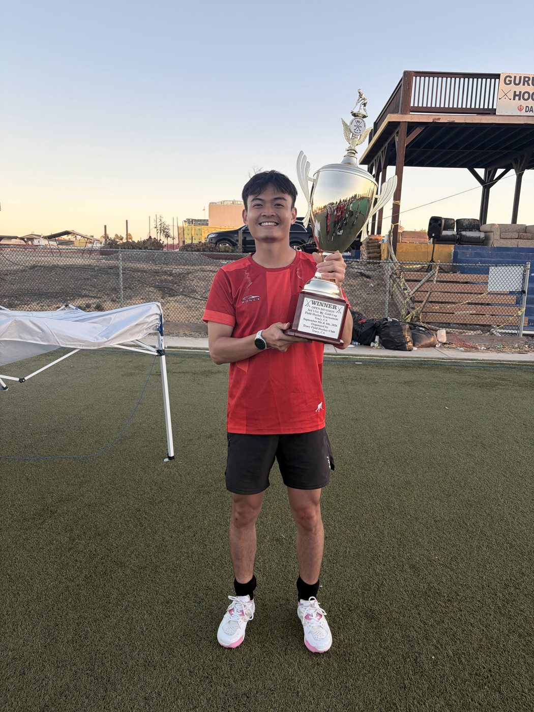 Holding a tournament trophy